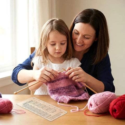 Mother and daughter using Quick Gauge Ruler For Knitting And Crochet No Sweat Stitch Measurement Tool With Clear Grid Layout.