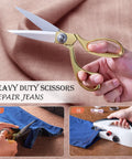 Hand holding gold-handled scissors, cutting blue fabric, with small images showing cutting and sewing steps, labeled 'Heavy Duty Scissors Repair Jeans'.