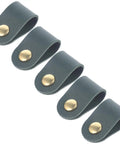 Keep Your Gear Totally Tangle Free With These Five Cable Organizer Straps using dark green faux leather with brass snaps.