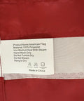 Close-up of USA Flag 2.5x4 Ft Pole Sleeve Banner Style With Embroidered Stars And Sewn Stripes Heavy Duty Durable Polyester tag details