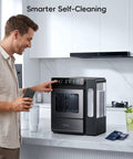 Smart Nugget Ice Maker For Countertop With Smartphone App Control And A Spacious 1.14 Gallon Side Tank Serving Forty Pounds Of Fresh Crunch Ice Daily Features Smooth Sailing Setup And Live Tds Water Quality Checks in modern kitchen with man using app.