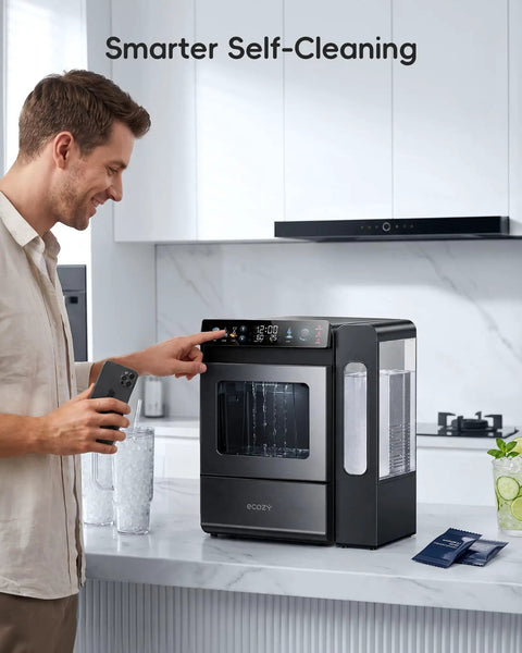 Smart Nugget Ice Maker For Countertop With Smartphone App Control And A Spacious 1.14 Gallon Side Tank Serving Forty Pounds Of Fresh Crunch Ice Daily Features Smooth Sailing Setup And Live Tds Water Quality Checks in modern kitchen with man using app.