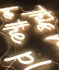 Close-up of Large LED Neon Sign This Must Be The Place Wall Decor For Bedroom Bar Office Cafe Party Romantic Night Light 21.65 x 12.4 Inches Customizable Neon Light For Home Or Business Vibe Boost Gift with warm glow.
