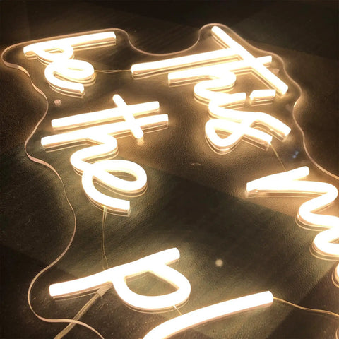 Close-up of Large LED Neon Sign This Must Be The Place Wall Decor For Bedroom Bar Office Cafe Party Romantic Night Light 21.65 x 12.4 Inches Customizable Neon Light For Home Or Business Vibe Boost Gift with warm glow.