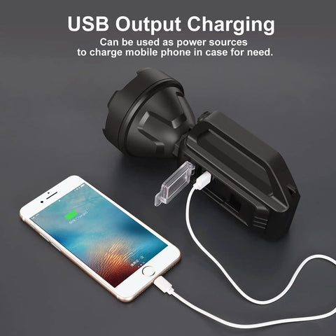 Beast Mode Brightness Rechargeable Spotlight Flashlight with USB Output charging a smartphone, black