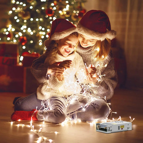 Family enjoying festive lights with Beefy 480W 10A Adjustable DC Power Supply With Digital LED Display for holiday decor.