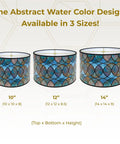 Three sizes of Dope Handmade Drum Lamp Shade in cool hues, abstract watercolor design with brass spider fitter.