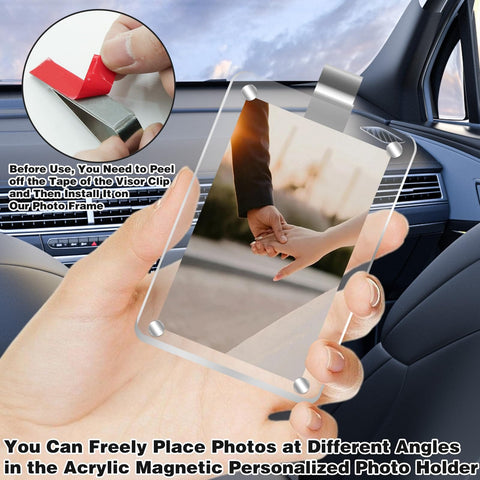 Person holding Two Pack Acrylic Magnetic Car Photo Holder Visor Clip Set Must Have Personalized Picture Frame in a car interior