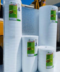 Heavy Duty Three Millimeter Foam Core Radiant Barrier Roll blocks summer heat, featuring four rolls with white vinyl surfaces.