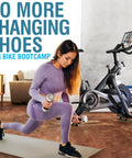 Woman exercising beside exercise bike, Toe Cage Straps For Peloton Pedals Convert Look Delta To Toe Cage Straps For Indoor Cycling