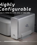 Tough Aluminum Four Slot Nvme M.2 Ssd Enclosure With Blazing Usb4 Kick Thunderbolt Sync And Optimized SoftRAID Config Built For Epic Hot Swap Storage Rigs On Mac Or Windows Pc next to a desktop.