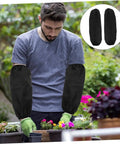 Oilproof Long Arm Sleeves For Men And Women With Heavy Duty Gunk Shielding protecting arms during gardening activities.