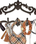 Knockout Five Hook Cast Iron Wall Hanger In Rustic Brown Fleur De Lis Farmhouse Entryway Coat Rack with keys and bags hanging.