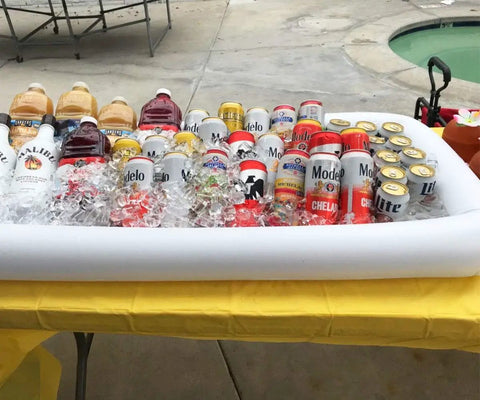 Inflatable Serving Bar For Summer Parties With Ice Chiller, Buffet Station, Drink Holder And Cooler Tray, Large 51.5 By 24.5 Inch Indoor Outdoor Party Accessory displaying drinks on ice