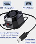 Close-up of USB Rechargeable Bike Alarm With Remote Wireless Motion Sensor Anti Theft System, showing USB-C port and charging cable.