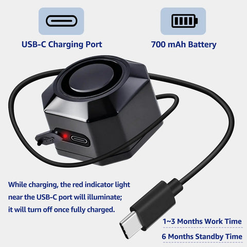 Close-up of USB Rechargeable Bike Alarm With Remote Wireless Motion Sensor Anti Theft System, showing USB-C port and charging cable.
