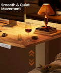 Ergear 63 Inch L Shaped Electric Standing Desk Adjustable Height Light Vintage Finish with smooth and quiet operation in setup.