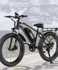 Fat Tire Electric Beast Bike With 1500W Peak Motor 48V 15Ah Battery on mountain road with lockable suspension and 7 speed gears