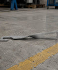 Heavy Duty Stainless Steel Car Door Stopper And Holder With Leather Cover For Parking Ventilation Keeps Rear Door Securely Open And Fresh Air Circulation Perfect Accessory lying on a concrete floor.