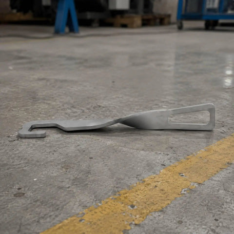 Heavy Duty Stainless Steel Car Door Stopper And Holder With Leather Cover For Parking Ventilation Keeps Rear Door Securely Open And Fresh Air Circulation Perfect Accessory lying on a concrete floor.