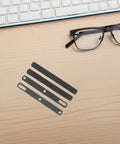 Four Piece Top Tier Keyboard Soundproof Foam Silencer For Space Bar Heavy Duty Acoustic Sponge Pads arranged on a desk.