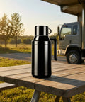 Road Ready Stainless Steel 12V And 24V Car Water Heater Plugs Right Into Cigarette Lighter on a wooden table outdoors.