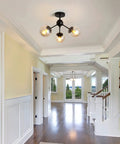 Three Light Glass Globe Chandelier Matte Black Nordic Style Semi Flush Mount Ceiling Fixture in a hallway