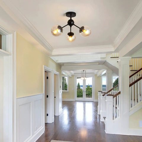 Three Light Glass Globe Chandelier Matte Black Nordic Style Semi Flush Mount Ceiling Fixture in a hallway