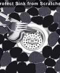 Pebble Kitchen Sink Mats Set Black 2 Pack PVC Sink Protectors for Stainless Steel showing pebble design around a drain