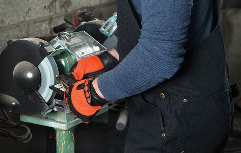 Person using bench grinder with Bench Grinding Wheel 1 Inch By 10 Inch By 1 Inch Arbor Type 1 Fine Grade For Metalworking And Tool Making.