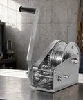 Tough As Nails 304 Stainless Steel Manual Winch Hoist Crank with Heavy Duty Gears shown in detail on a workbench.