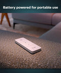 Smart Wireless Dimmer Switch V2 for Hue Lights No Bridge Needed on a couch, battery-powered remote for indoor lighting control