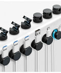 12 Pack 360 Degree Rotatable Spring Cable Clips With 1 Second Lock Adhesive Cord Holder for cord management on desk edge.