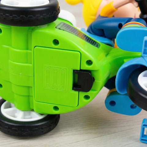 360 Degree Electric Stunt Tricycle Toy With LED Lights And Music, green underside with battery compartment and wheels