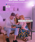 Family using Smart RGB LED Floor Lamp With Alexa Google Home Control in living room, illuminating with warm light.