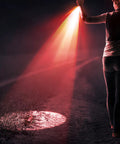 Person using Red Light Flashlight With LED Torch One Mode Red Lens Filter for night astronomy observation on a dark path.