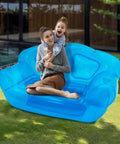Kick Back On This Hella Comfy Clear Inflatable Sofa Chair For Two Portable Twin Size Air Mattress Couch With No Sweat Setup Indoors Or On Camping Trips with a mother and child outdoors.