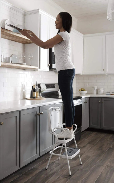 Person using Retro Style Chair And Flip Up Step Stool In White With Vinyl Seat And Steel Frame Dope Multi Purpose Counter Height Seat