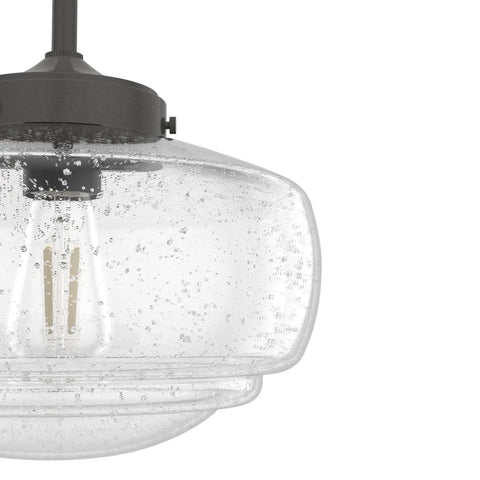 Close-up of Saddle Creek Schoolhouse Style 1-Light Pendant With Noble Bronze Finish And Seeded Glass Shade, dimmable design.