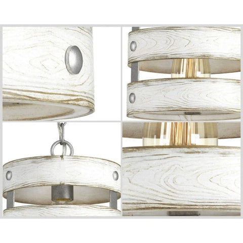 Close-up of coastal farmhouse pendant light dope with galvanized finish and open cage frame showing whitewashed bands.
