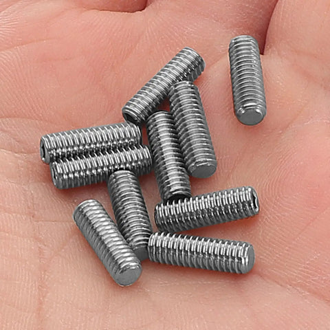 YoYo Axle Screw Kit 10pc Metric Socket Head Cap Grub Screws on hand, durable hardware for easy yoyo repair.