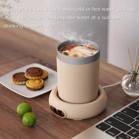 Keep Your Daily Brew Sizzling Hot This Smart Coffee Mug Warmer Uses An Ultra Smooth Metal Heating Base With Gravity Activated Control For Zero Fuss Desk Enjoyment with a heated cup and snacks on a desk.