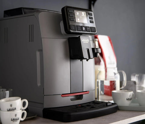 Automatic Espresso And Over Ice Coffee Maker With Professional Auto Milk Frother For Bold Iced Refreshers And Daily Grind Dominance In Sleek Moonlight Grey on countertop with cups.