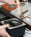 Built Like A Tank Stainless Steel Knock Box With Removable Interior Grounds Bin For Espresso Setups and Home Baristas Made For Busy Coffee Shops Without The Headache Featuring Durable Metal Construction, cleaning grounds.