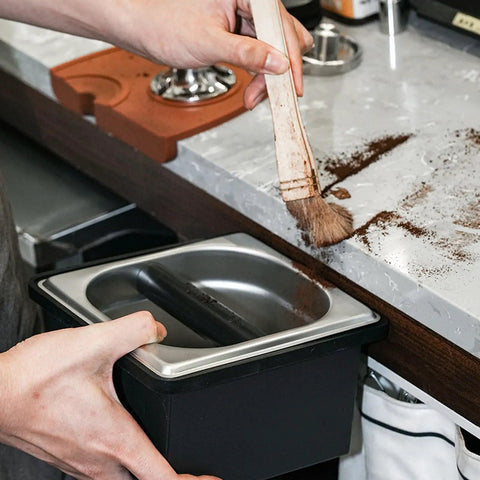 Built Like A Tank Stainless Steel Knock Box With Removable Interior Grounds Bin For Espresso Setups and Home Baristas Made For Busy Coffee Shops Without The Headache Featuring Durable Metal Construction, cleaning grounds.