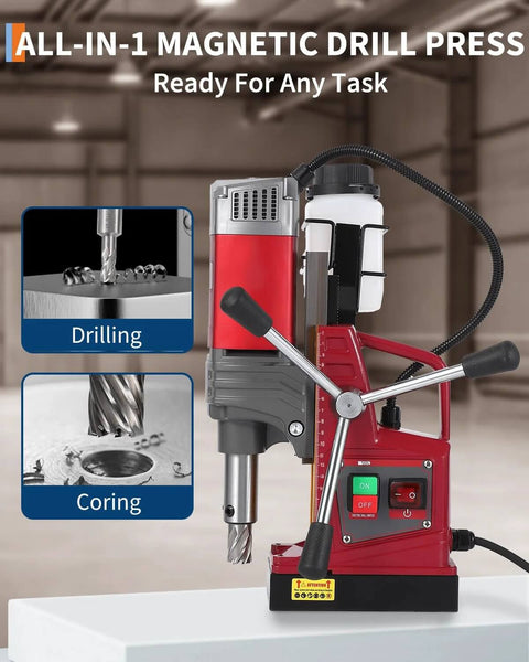 Front view of portable magnetic drill press with red and gray body, dual side handles, coolant bottle, and magnetic base