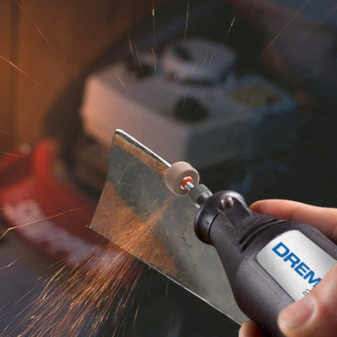 Super Handy Two Speed Mini Rotary Tool Kit With 21 Accessories being used for metal sharpening, showing sparks from grinder.