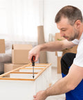 Person assembling furniture using Kickass Quality 100 Pack Black Stainless Steel Wood Screws Flat Head Phillips Drive 8 X 1 2 Inch.