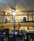 Powerlift Green Polyester Endless Round Sling 6 Feet Long With 5300 Lb Vertical Capacity lifting a kayak in a garage setup