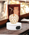 Rotatable Jewelry Display Stand With Electric Motorized Turntable Skid Base, golden apple design on white base showcasing jewelry.
